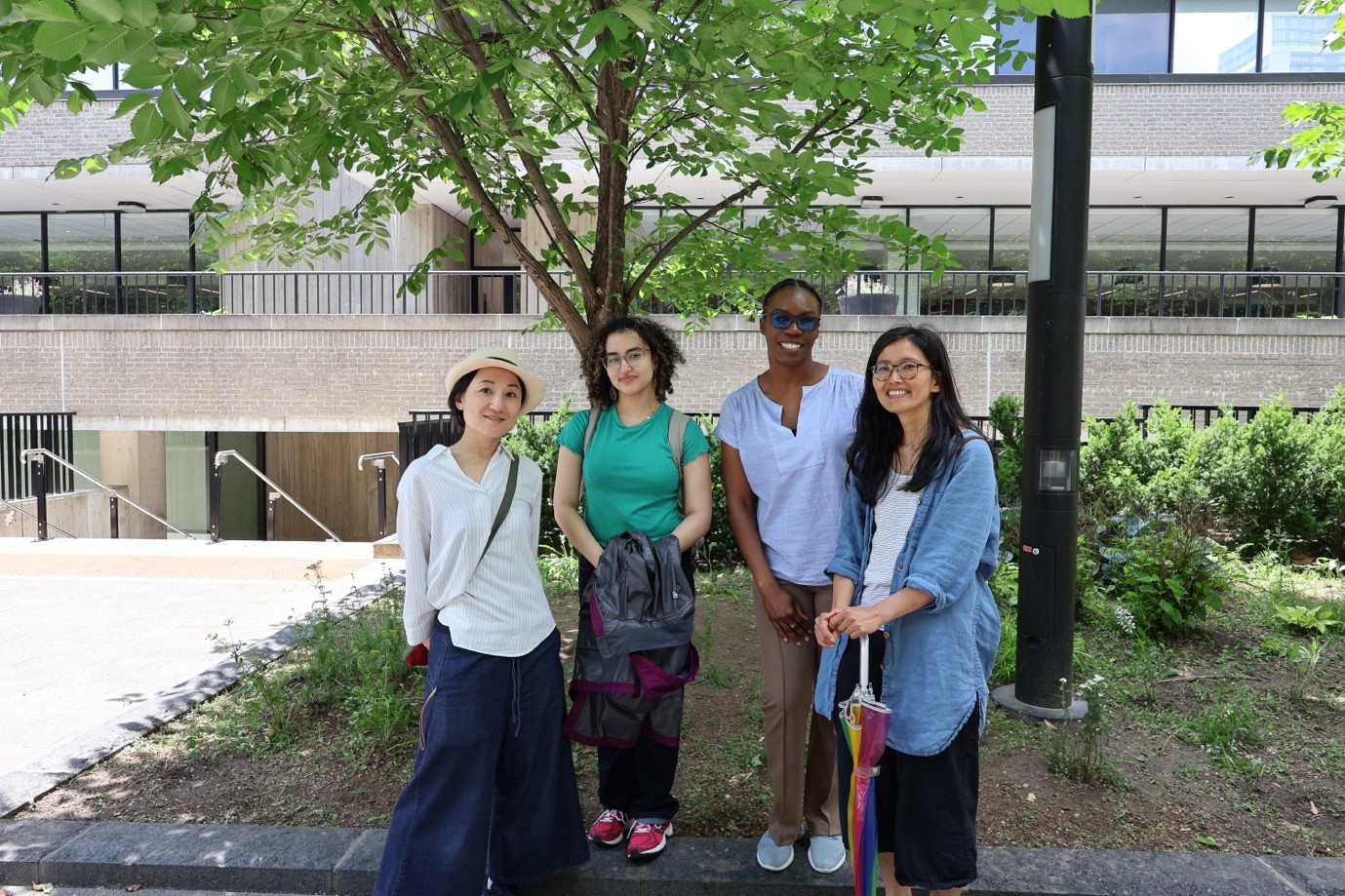A photo of the event hosts in front of a tree, Dr. Yukari Seko, Jomanah Hafez, Erica Wilkinson, and Dr. Chizuru Nobe-Ghelani.